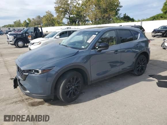 2023 Mazda CX-5 S Carbon Edition z VIN JM3KFBCMXP0188710, wystawiony jako Copart lot #71792655 z przebiegiem Nie podano mil oraz Szkoda całkowita • Salvage title. Historia ofert i sprzedaży dostępna na DreamBid. Obrazek 1.
