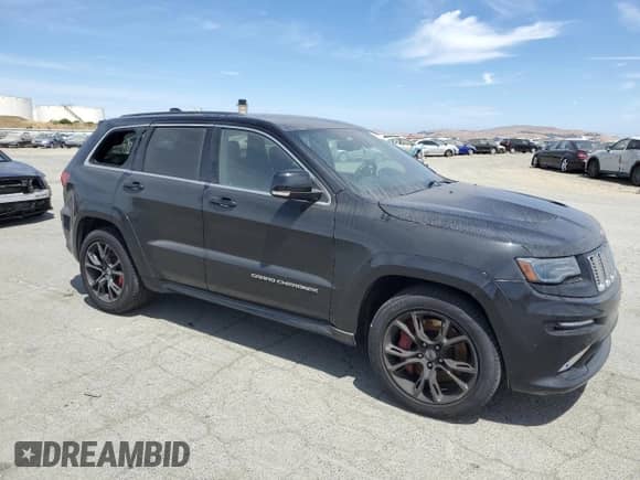 2014 Jeep Grand Cherokee SRT-8 z VIN 1C4RJFDJXEC379766, wystawiony jako Copart lot #63656015 z przebiegiem Nie podano mil oraz Szkoda całkowita • Salvage title. Historia ofert i sprzedaży dostępna na DreamBid. Obrazek 4.