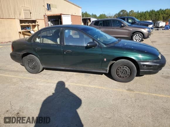 1997 Saturn SL with VIN 1G8ZH5281VZ133993, listed as a Copart auction lot 87155774 with 135,932 mi miles and Salvage title. Bid and sale history available at DreamBid. Image 4.