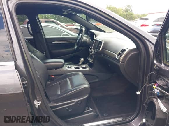 2018 Jeep Grand Cherokee Overland with VIN 1C4RJFCG6JC411466, listed as a IAAI auction lot 42276191 with 95,879 mi miles and . Bid and sale history available at DreamBid. Image 5.