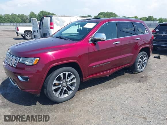 2017 Jeep Grand Cherokee Overland with VIN 1C4RJFCG7HC658943, listed as a IAAI auction lot 42282213 with 103,291 mi miles and . Bid and sale history available at DreamBid. Image 2.