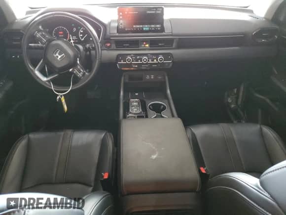 2023 Honda Pilot Touring с VIN 5FNYG1H77PB048953, выставлен на аукционе Copart как лот 70189975 с пробегом 26 433 миль миль и Списание • Salvage title. История ставок и продаж доступна на DreamBid. Изображение 8.