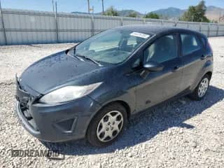2011 Ford Fiesta SE with VIN 3FADP4EJXBM196640, listed as a Copart auction lot 64479785 with 125,473 mi miles and Salvage title. Bid and sale history available at DreamBid. Image 1.