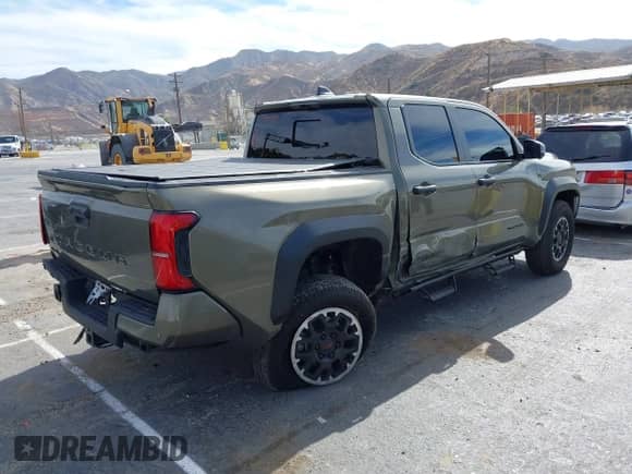2024 Toyota Tacoma SR5 with VIN 3TMLB5JN6RM027745, listed as a IAAI auction lot 41479793 with 16,376 mi miles and . Bid and sale history available at DreamBid. Image 4.