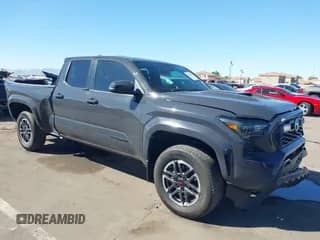 2024 Toyota Tacoma SR5 with VIN 3TMLB5FN8RM005075, listed as a IAAI auction lot 43290415 with 20,318 mi miles and . Bid and sale history available at DreamBid. Image 1.