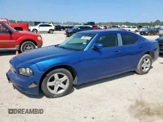 2010 Dodge Charger with VIN 2B3CA4CD5AH108922, listed as a Copart auction lot 70945145 with 124,067 mi miles and Salvage title. Bid and sale history available at DreamBid. Image 1.