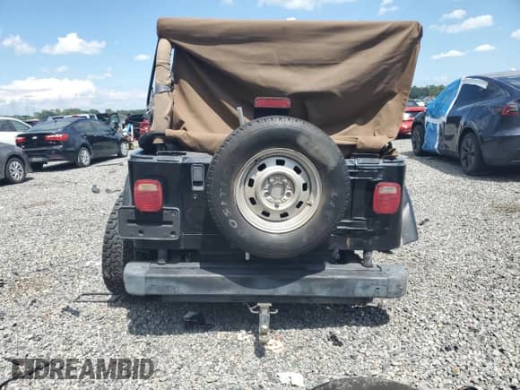 1997 Jeep Wrangler Sahara с VIN 1J4FY49S5VP542704, выставлен на аукционе Copart как лот 69632005 с пробегом 151 468 миль миль и Списание • Salvage title. История ставок и продаж доступна на DreamBid. Изображение 6.