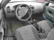 2005 Hyundai Accent GLS z VIN KMHCG35C55U341192, wystawiony jako Copart lot #70708994 z przebiegiem 174 872 mil mil oraz Szkoda całkowita • Salvage title. Historia ofert i sprzedaży dostępna na DreamBid. Obrazek 8.