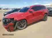2014 Jeep Grand Cherokee SRT-8 z VIN 1C4RJFDJ4EC202579, wystawiony jako Copart lot #62811605 z przebiegiem 83 024 mil mil oraz Szkoda całkowita • Salvage title. Historia ofert i sprzedaży dostępna na DreamBid. Obrazek 1.