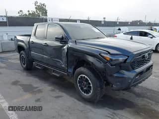 2024 Toyota Tacoma TRD Off Road with VIN 3TMLB5JN6RM051513, listed as a IAAI auction lot 43140179 with 13,703 mi miles and . Bid and sale history available at DreamBid. Image 1.