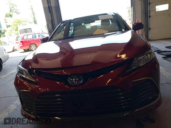 2022 Toyota Camry Hybrid LE with VIN 4T1C31AK7NU585634, listed as a IAAI auction lot 42443856 with 31,756 mi miles and . Bid and sale history available at DreamBid. Image 12.
