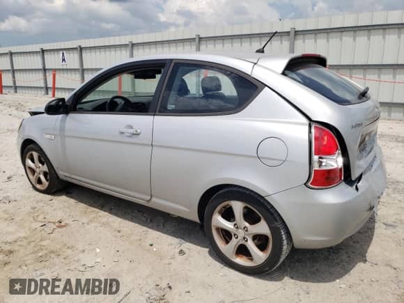 2007 Hyundai Accent SE z VIN KMHCN36C67U020057, wystawiony jako Copart lot #61012645 z przebiegiem 155 714 mil mil oraz Szkoda całkowita • Salvage title. Historia ofert i sprzedaży dostępna na DreamBid. Obrazek 2.