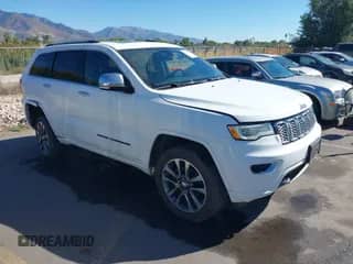 2018 Jeep Grand Cherokee Overland with VIN 1C4RJFCG7JC324708, listed as a IAAI auction lot 43294688 with 131,457 mi miles and . Bid and sale history available at DreamBid. Image 1.