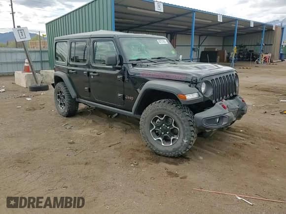 2023 Jeep Wrangler Rubicon with VIN 1C4JJXFM8PW607551, listed as a Copart auction lot 49731885 with 20,227 mi miles and Salvage title. Bid and sale history available at DreamBid. Image 12.
