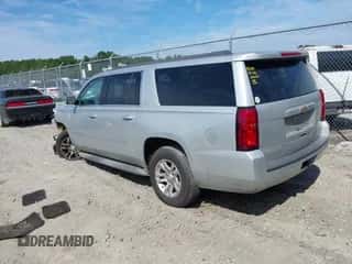 2015 Chevrolet Suburban LT z VIN 1GNSCJKC1FR547805, wystawiony jako IAAI lot #43186369 z przebiegiem 277 934 mil mil oraz . Historia ofert i sprzedaży dostępna na DreamBid. Obrazek 3.