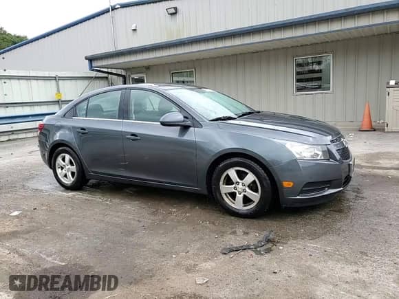 2013 Chevrolet Cruze 1LT z VIN 1G1PC5SB7D7229282, wystawiony jako Copart lot #85850445 z przebiegiem 122 534 mil mil oraz Szkoda całkowita • Salvage title. Historia ofert i sprzedaży dostępna na DreamBid. Obrazek 13.