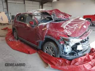 2022 Mazda CX-5 S Carbon Edition z VIN JM3KFBCM0N1566735, wystawiony jako IAAI lot #40617286 z przebiegiem Nie podano mil oraz . Historia ofert i sprzedaży dostępna na DreamBid. Obrazek 1.