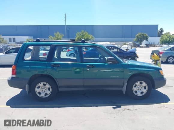 1999 Subaru Forester L with VIN JF1SF6353XG711250, listed as a IAAI auction lot 42805015 with 223,479 mi miles and . Bid and sale history available at DreamBid. Image 13.