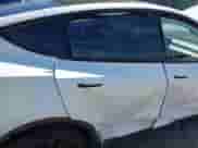 2023 Tesla Model Y Long Range with VIN 7SAYGDEE9PA033911, listed as a IAAI auction lot 43202182 with 35,938 mi miles and . Bid and sale history available at DreamBid. Image 6.