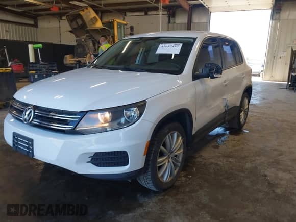 2013 Volkswagen Tiguan with VIN WVGCV3AX7DW605594, listed as a IAAI auction lot 42057457 with 131,629 mi miles and . Bid and sale history available at DreamBid. Image 2.