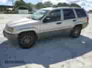 2004 Jeep Grand Cherokee Laredo with VIN 1J4GX48S64C302687, listed as a Copart auction lot 85599075 with 213,057 mi miles and Salvage title. Bid and sale history available at DreamBid. Image 1.