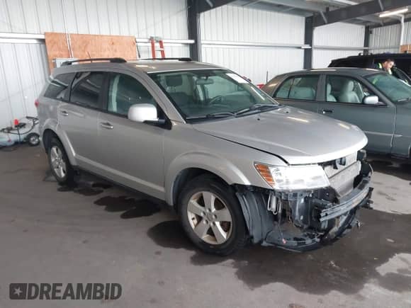 2012 Dodge Journey SXT z VIN 3C4PDDBG1CT205905, wystawiony jako IAAI lot #43351815 z przebiegiem 148 244 mil mil oraz . Historia ofert i sprzedaży dostępna na DreamBid. Obrazek 1.