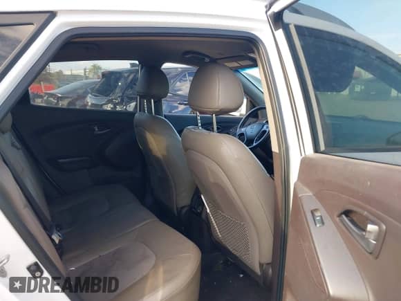 2014 Hyundai Tucson Limited with VIN KM8JU3AG6EU879652, listed as a IAAI auction lot 43390014 with 181,767 mi miles and . Bid and sale history available at DreamBid. Image 8.