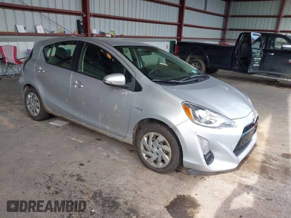 2015 Toyota Prius One z VIN JTDKDTB30F1580908, wystawiony jako IAAI lot #42583483 z przebiegiem 227 830 mil mil oraz . Historia ofert i sprzedaży dostępna na DreamBid. Obrazek 1.