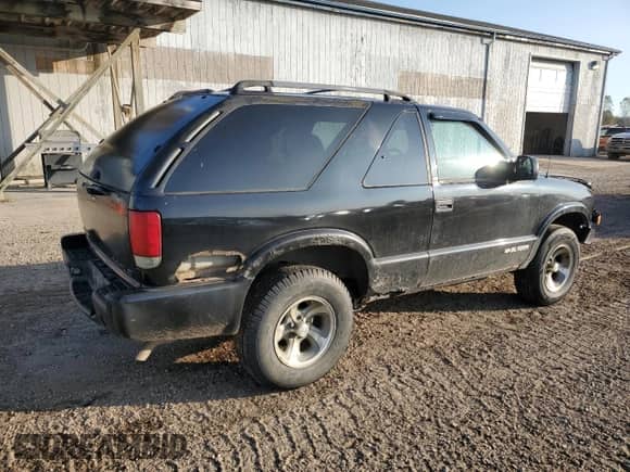 2003 Chevrolet Blazer LS z VIN 1GNCS18X23K179317, wystawiony jako Copart lot #76594834 z przebiegiem 311 791 mil mil oraz Czysty tytuł • Clean title. Historia ofert i sprzedaży dostępna na DreamBid. Obrazek 3.