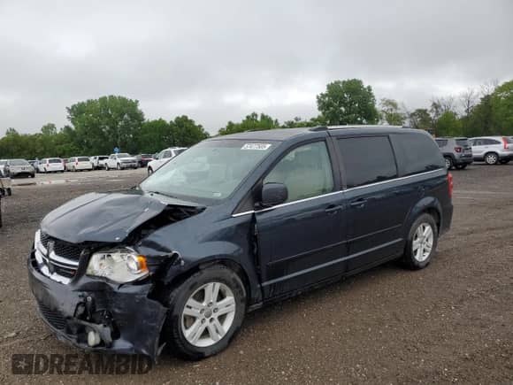 2013 Dodge Grand Caravan Crew with VIN 2C4RDGDG3DR747129, listed as a Copart auction lot 57477505 with 252,939 mi miles and Salvage title. Bid and sale history available at DreamBid. Image 1.