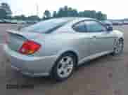2003 Hyundai Tiburon GT с VIN KMHHN65F63U036899, выставлен на аукционе IAAI как лот 42148935 с пробегом 203 485 миль миль и . История ставок и продаж доступна на DreamBid. Изображение 4.