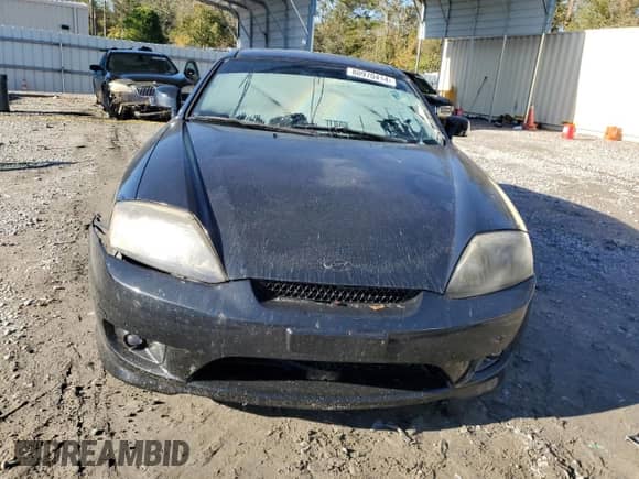 2006 Hyundai Tiburon GS с VIN KMHHM65D06U207409, выставлен на аукционе Copart как лот 80970414 с пробегом 173 396 миль миль и Списание • Salvage title. История ставок и продаж доступна на DreamBid. Изображение 5.