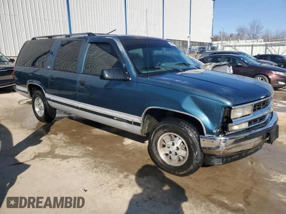 1994 Chevrolet Suburban with VIN 1GNEC16K8RJ405050, listed as a Copart auction lot 46087905 with 284,582 mi miles and Salvage title. Bid and sale history available at DreamBid. Image 4.