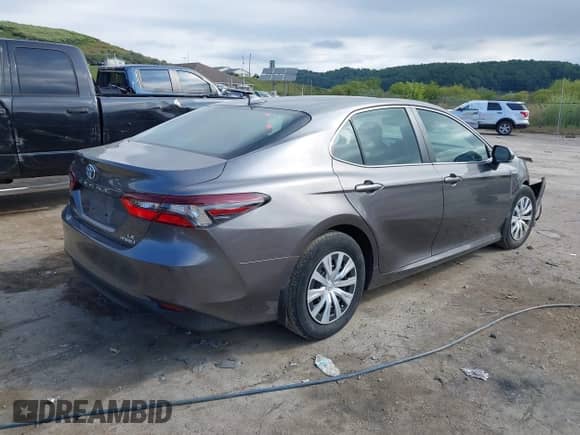 2021 Toyota Camry Hybrid LE with VIN 4T1H31AK0MU553127, listed as a IAAI auction lot 43099811 with 27,442 mi miles and . Bid and sale history available at DreamBid. Image 4.