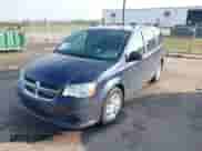 2013 Dodge Grand Caravan SXT with VIN 2C4RDGCG3DR582958, listed as a IAAI auction lot 43477454 with 132,299 mi miles and . Bid and sale history available at DreamBid. Image 2.