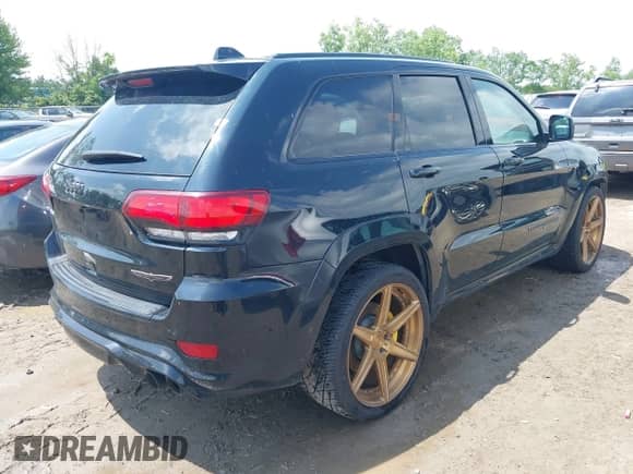 2018 Jeep Grand Cherokee Trackhawk with VIN 1C4RJFN96JC293806, listed as a IAAI auction lot 42503526 with 42,666 mi miles and . Bid and sale history available at DreamBid. Image 4.