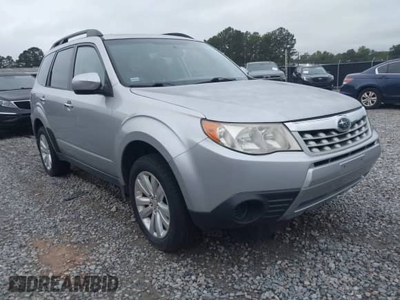 2012 Subaru Forester X Premium z VIN JF2SHBDC0CH459067, wystawiony jako IAAI lot #43386560 z przebiegiem 181 633 mil mil oraz . Historia ofert i sprzedaży dostępna na DreamBid. Obrazek 1.