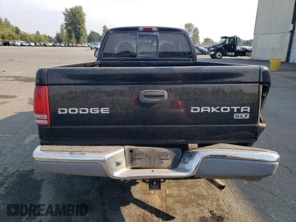 2004 Dodge Dakota SLT с VIN 1D7HG42N14S565713, выставлен на аукционе Copart как лот 70764455 с пробегом 118 859 миль миль и Списание • Salvage title. История ставок и продаж доступна на DreamBid. Изображение 6.