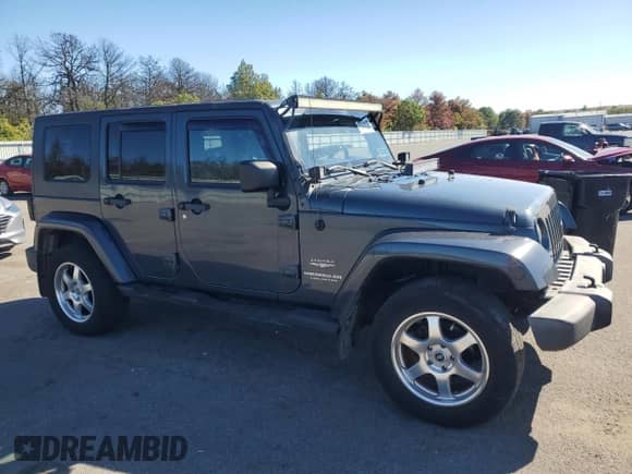 2007 Jeep Wrangler Unlimited Sahara z VIN 1J4GA591X7L147255, wystawiony jako Copart lot #82341025 z przebiegiem 189 755 mil mil oraz Czysty tytuł • Clean title. Historia ofert i sprzedaży dostępna na DreamBid. Obrazek 4.