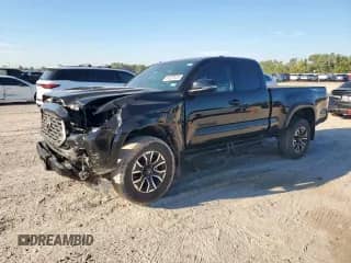 2023 Toyota Tacoma SR with VIN 3TYRZ5CN0PT028202, listed as a Copart auction lot 84628925 with 31,485 mi miles and Salvage title. Bid and sale history available at DreamBid. Image 1.