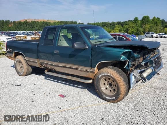 1997 GMC Sierra 1500 z VIN 1GTEK19R4VE531574, wystawiony jako Copart lot #64047355 z przebiegiem 221 815 mil mil oraz Szkoda całkowita • Salvage title. Historia ofert i sprzedaży dostępna na DreamBid. Obrazek 4.