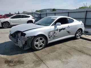 2005 Hyundai Tiburon GT с VIN KMHHN65F05U169144, выставлен на аукционе Copart как лот 67944695 с пробегом 139 483 миль миль и Списание • Salvage title. История ставок и продаж доступна на DreamBid. Изображение 1.