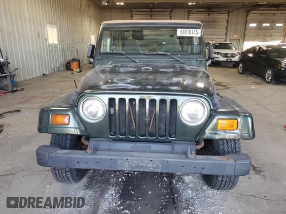 1997 Jeep Wrangler Sahara z VIN 1J4FY49S0VP476305, wystawiony jako Copart lot #68818145 z przebiegiem 180 174 mil mil oraz Czysty tytuł • Clean title. Historia ofert i sprzedaży dostępna na DreamBid. Obrazek 5.