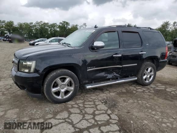 2011 Chevrolet Tahoe LTZ with VIN 1GNSKCE05BR254175, listed as a Copart auction lot 80693645 with 265,816 mi miles and Salvage title. Bid and sale history available at DreamBid. Image 1.