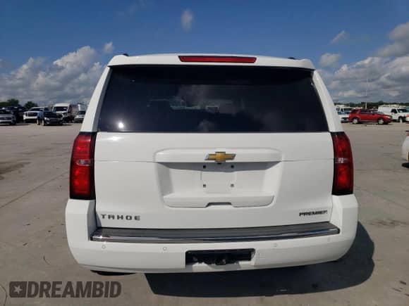 2019 Chevrolet Tahoe Premier с VIN 1GNSKCKC0KR199083, выставлен на аукционе Copart как лот 62394085 с пробегом 73 371 миль миль и Списание • Salvage title. История ставок и продаж доступна на DreamBid. Изображение 6.