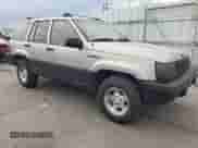 1995 Jeep Grand Cherokee Laredo with VIN 1J4GZ58S2SC703196, listed as a Copart auction lot 68571944 with 264,876 mi miles and Clean title. Bid and sale history available at DreamBid. Image 4.