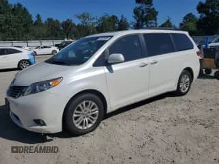 2017 Toyota Sienna XLE with VIN 5TDYZ3DC7HS824312, listed as a Copart auction lot 84629685 with 153,917 mi miles and Salvage title. Bid and sale history available at DreamBid. Image 1.