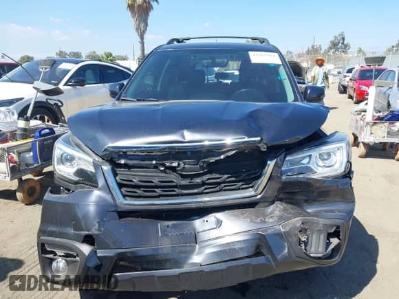 2018 Subaru Forester Touring with VIN JF2SJAWC7JH486100, listed as a IAAI auction lot 43311569 with 90,905 mi miles and . Bid and sale history available at DreamBid. Image 12.