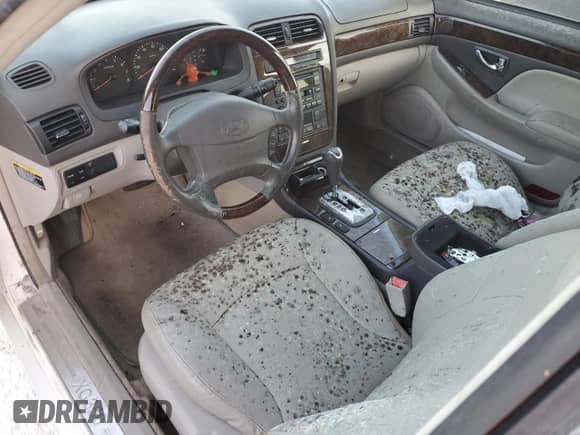 2003 Hyundai XG с VIN KMHFU45E63A237404, выставлен на аукционе Copart как лот 77546824 с пробегом Не указан миль и На запчасти • Non repairable. История ставок и продаж доступна на DreamBid. Изображение 8.