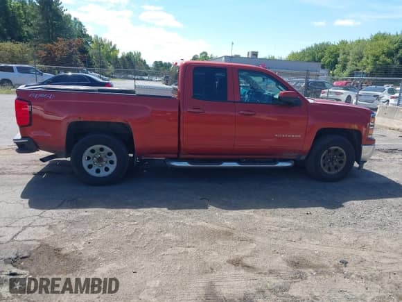 2015 Chevrolet Silverado 1500 LT z VIN 1GCVKREH1FZ194142, wystawiony jako IAAI lot #43016369 z przebiegiem 213 511 mil mil oraz . Historia ofert i sprzedaży dostępna na DreamBid. Obrazek 13.